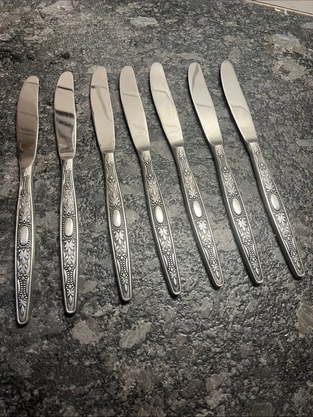 Vintage Stainless Steel Butter Knife Set of 7. Floral Pattern Silver Antiqued